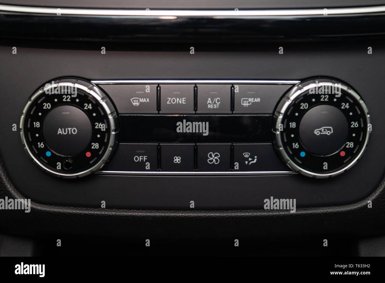 Rear central console on the panel inside the car closeup with climate