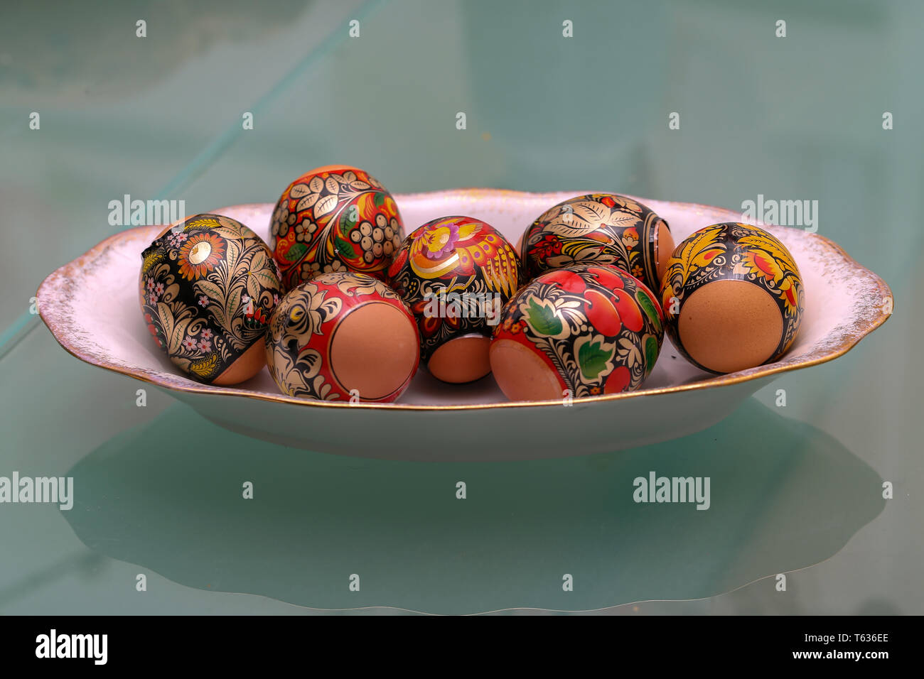 Easter traditions. Compositions with painted Easter eggs. Stock Photo