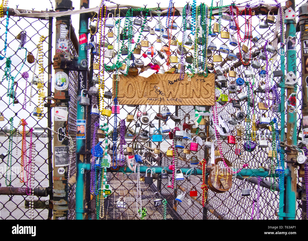Hand-made sign reading 'Love Wins' on a fence along the Mississippi River.  New Orleans, LA. Stock Photo