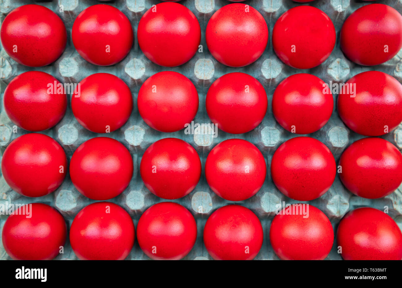Orthodox Easter. Red eggs in carton packaging, top view, full background Stock Photo