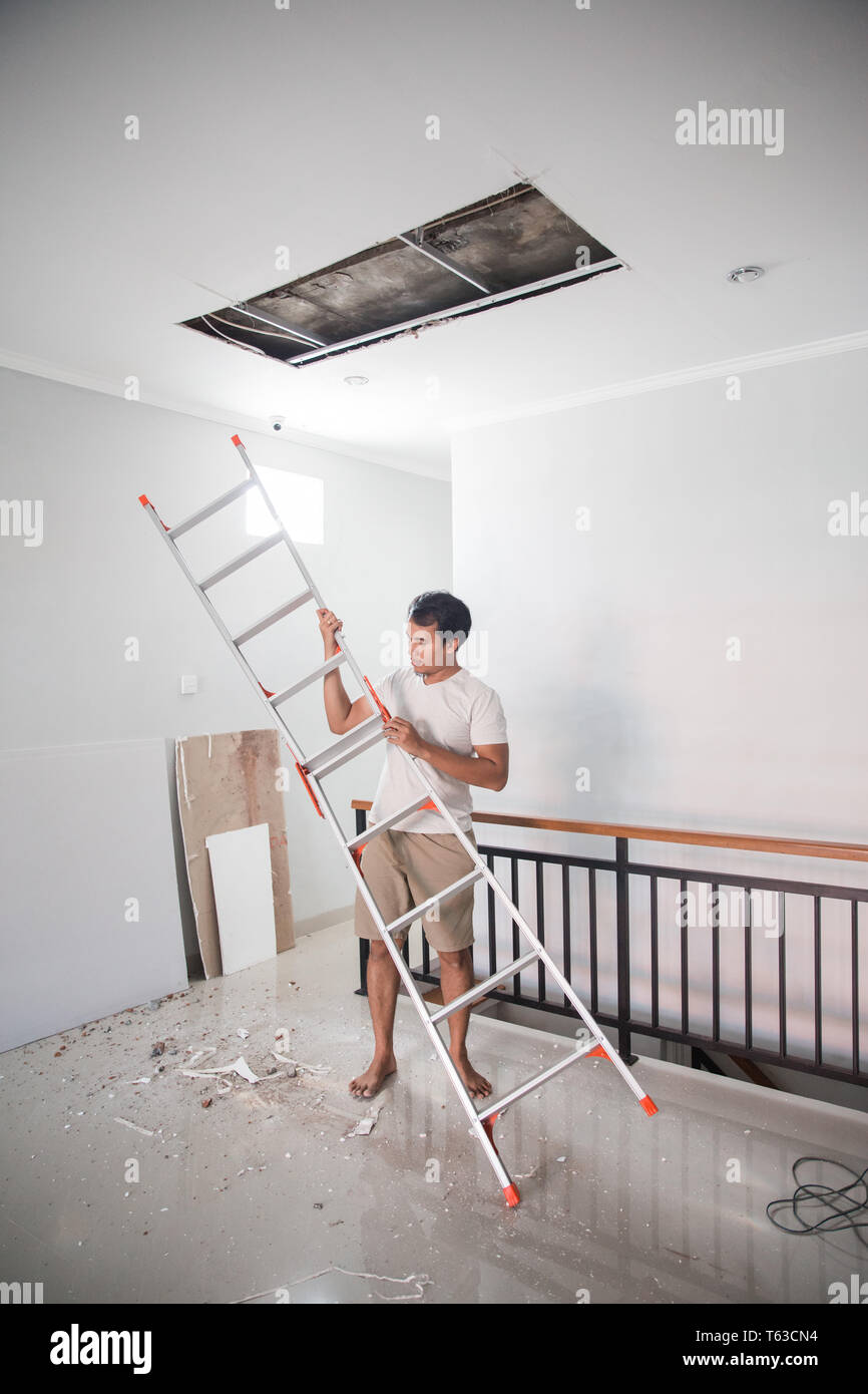Man Repair The Broken Ceiling Stock Photo 244708944 Alamy