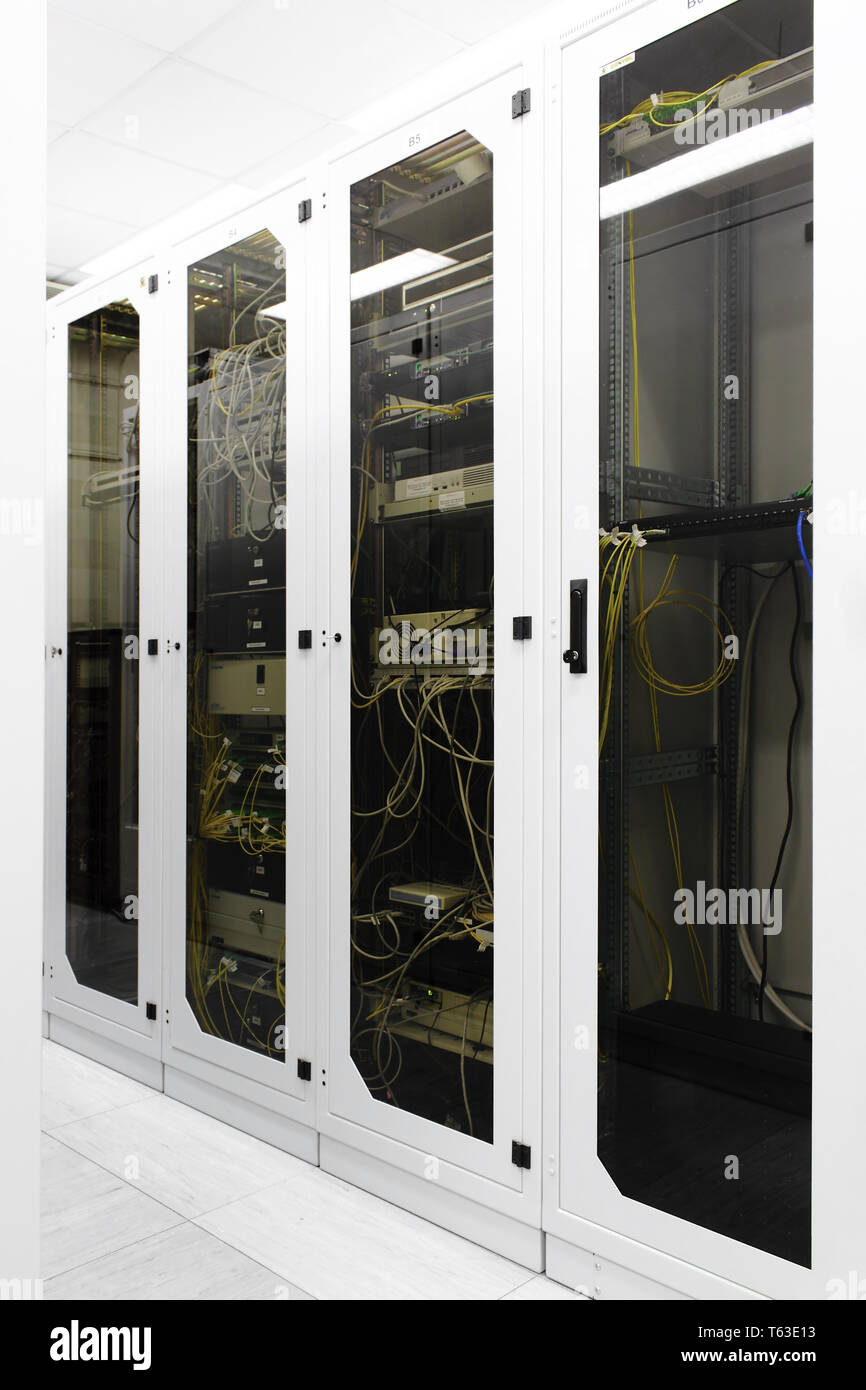 Racks with network equipment in technology telehouse room Stock Photo