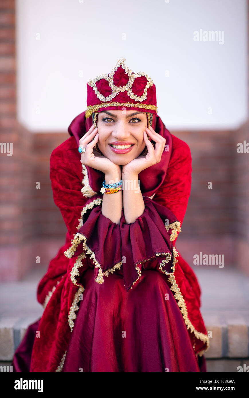 beautiful iranian lady in traditional outfit  smiling for camera Stock Photo