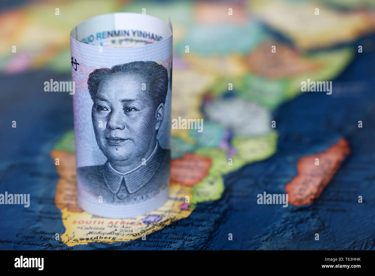 Chinese yuan on the map of Africa continent. Trading between China and african countries, tourism, economy and investment Stock Photo