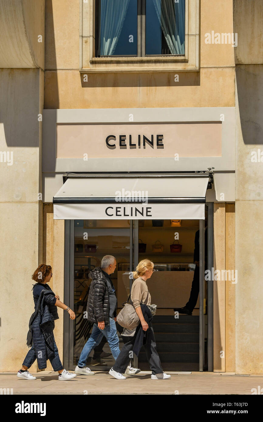 CANNES, FRANCE - APRIL 2019: People walking past the entrance of the Celine  store on the seafront in Cannes. Stock Photo