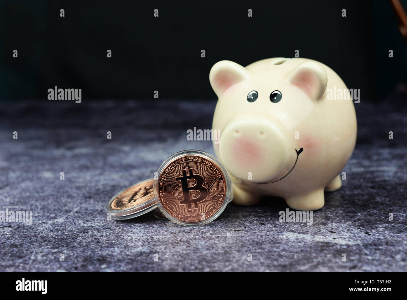 Bitcoin cryptocurrency money coins with a piggy bank on a dark background  for investment and earnings Stock Photo - Alamy