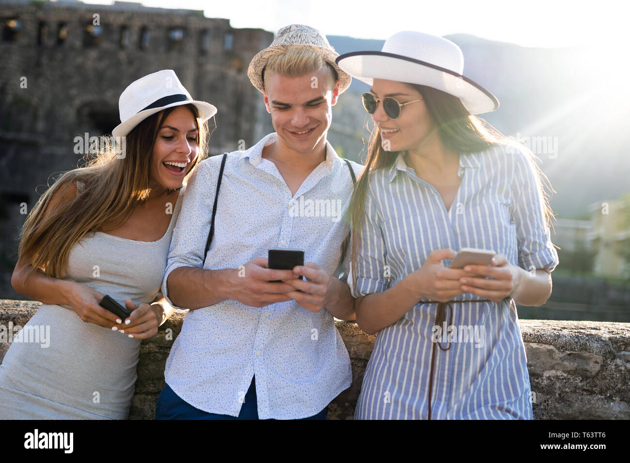 Group of friends spending quality time together in city Stock Photo