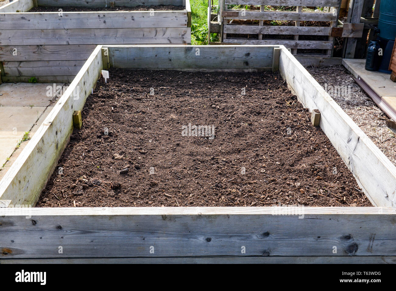 Raised planter box for growing vegetables and flowers Stock Photo Alamy