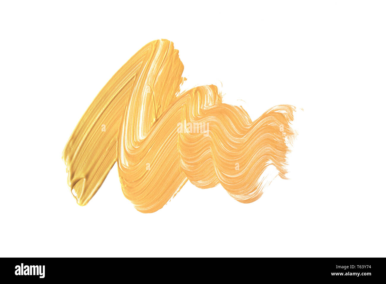 Gold stroke of the paint brush isolated on white background Stock Photo