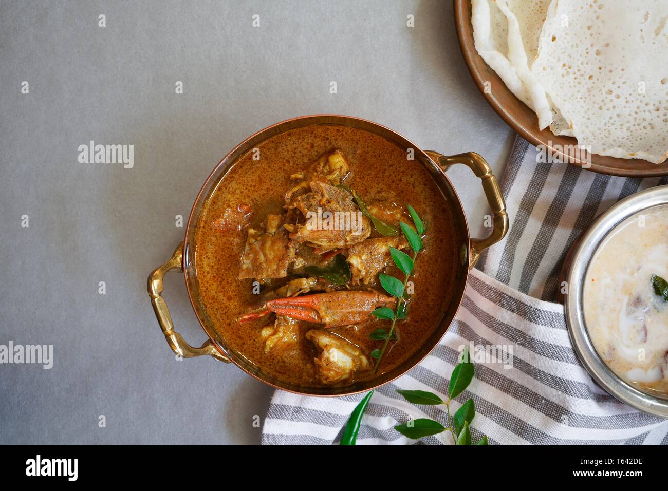 Kerala Spicy Crab curry served with Appam Stock Photo