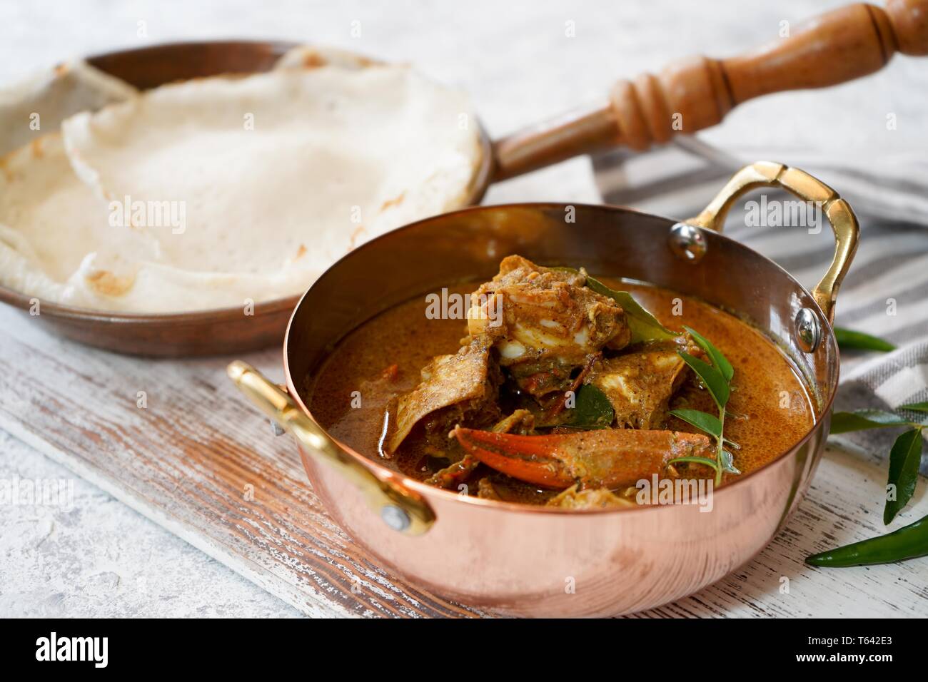 Kerala Spicy Crab curry served with Appam Stock Photo