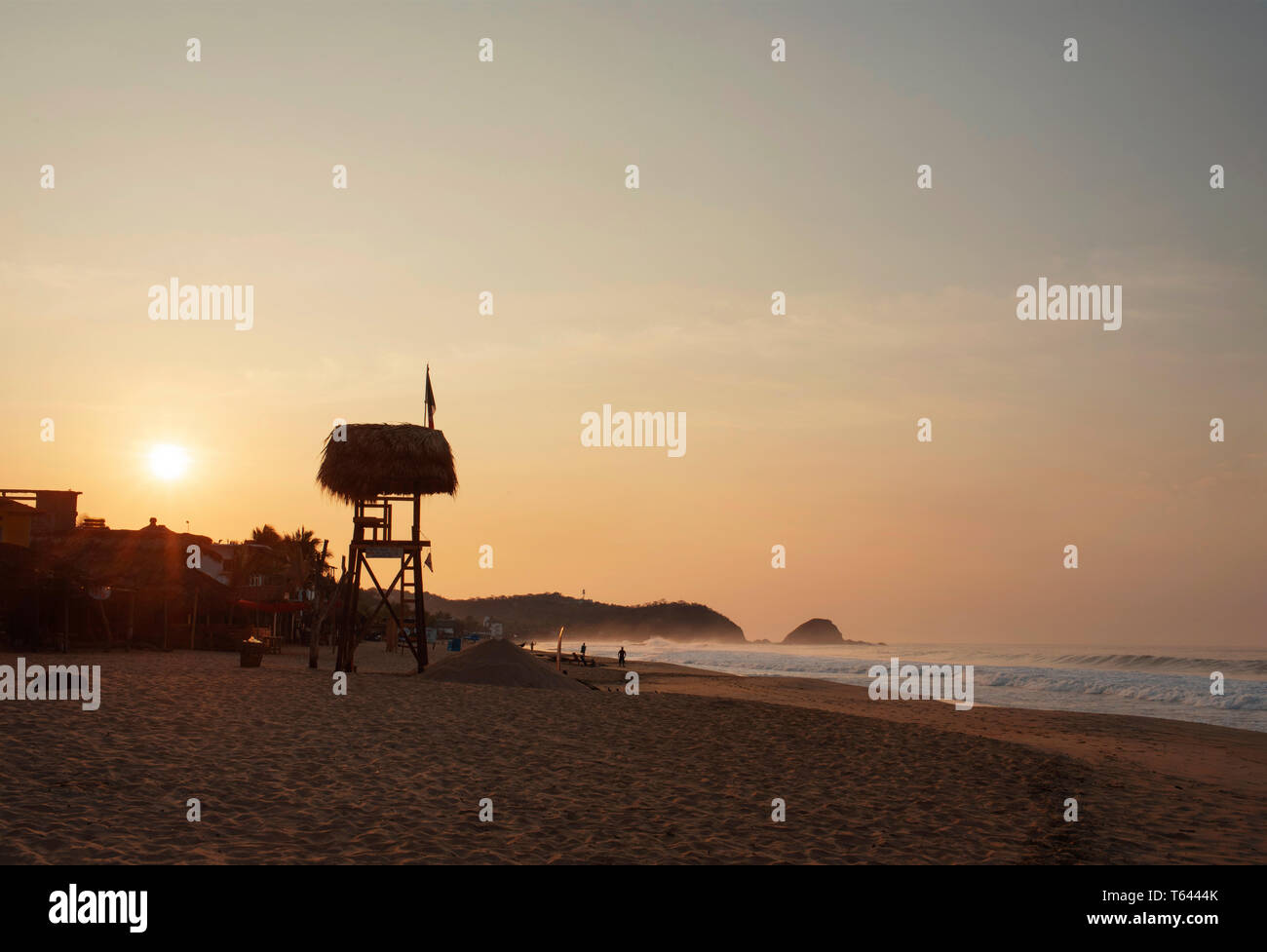 Lifeguard tower and scenic beach during sunrise. Zipolite, Oaxaca State, Mexico. Apr 2019 Stock Photo