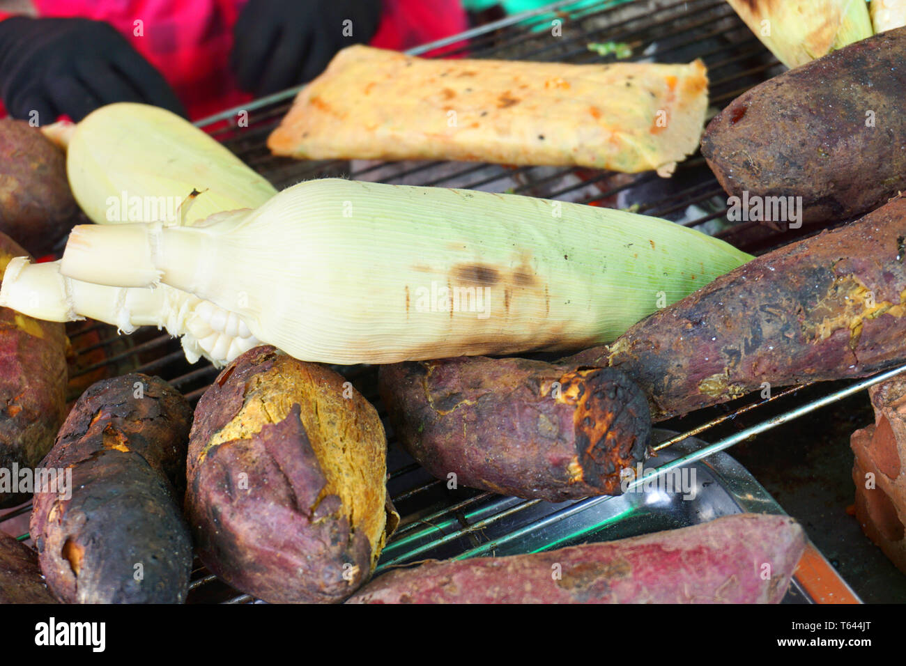 Khoai lang nuong - Delicious grilled whole sweet potatoes on grill charcoal Vietnamese street food weather Asian cuisine Da Lat Stock Photo - Alamy