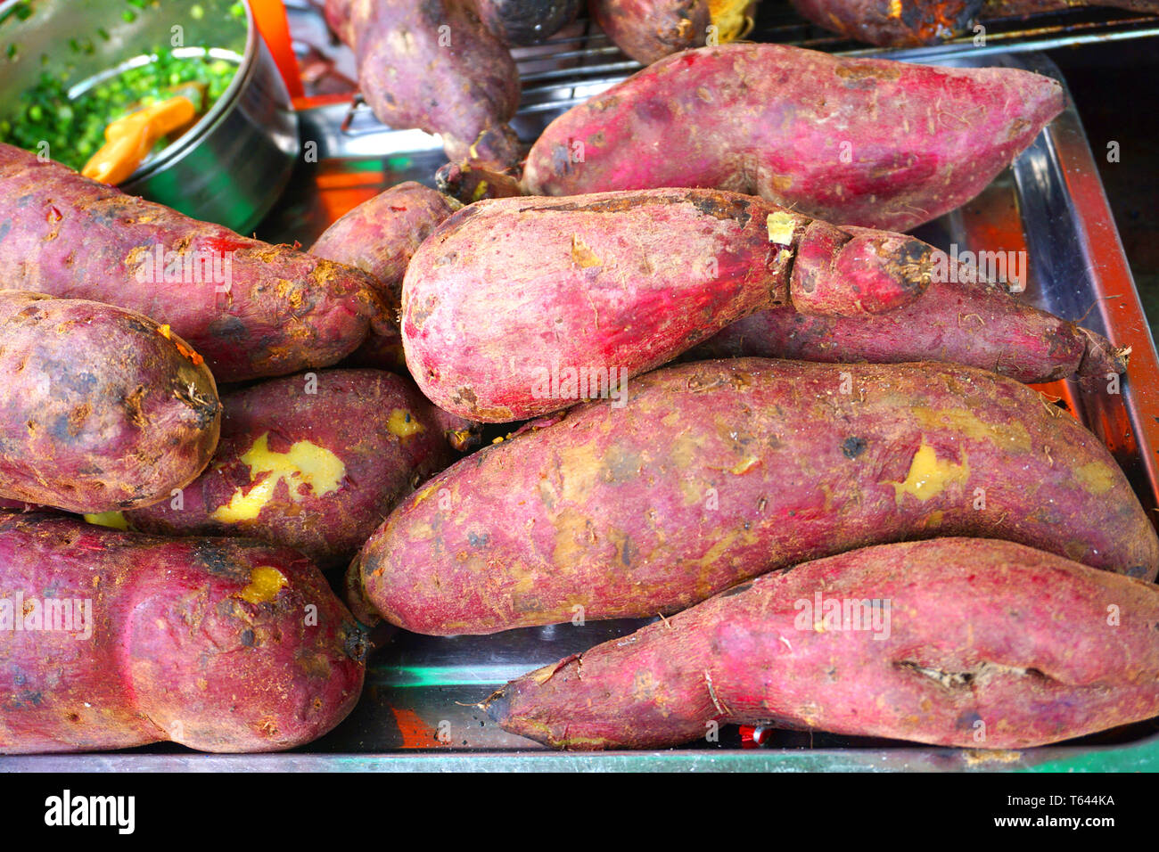 Khoai lang nuong Delicious grilled whole sweet potatoes on grill bar