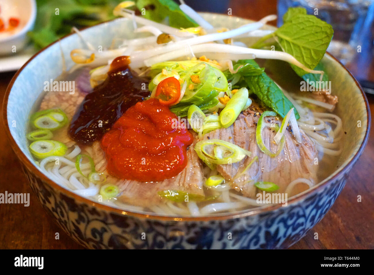 Pho bo - Delicious beef and chicken noodles soup Asian cuisine famous  Vietnamese food with beef stock spring onion hoisin sauce soy sauce chilly  herb Stock Photo - Alamy