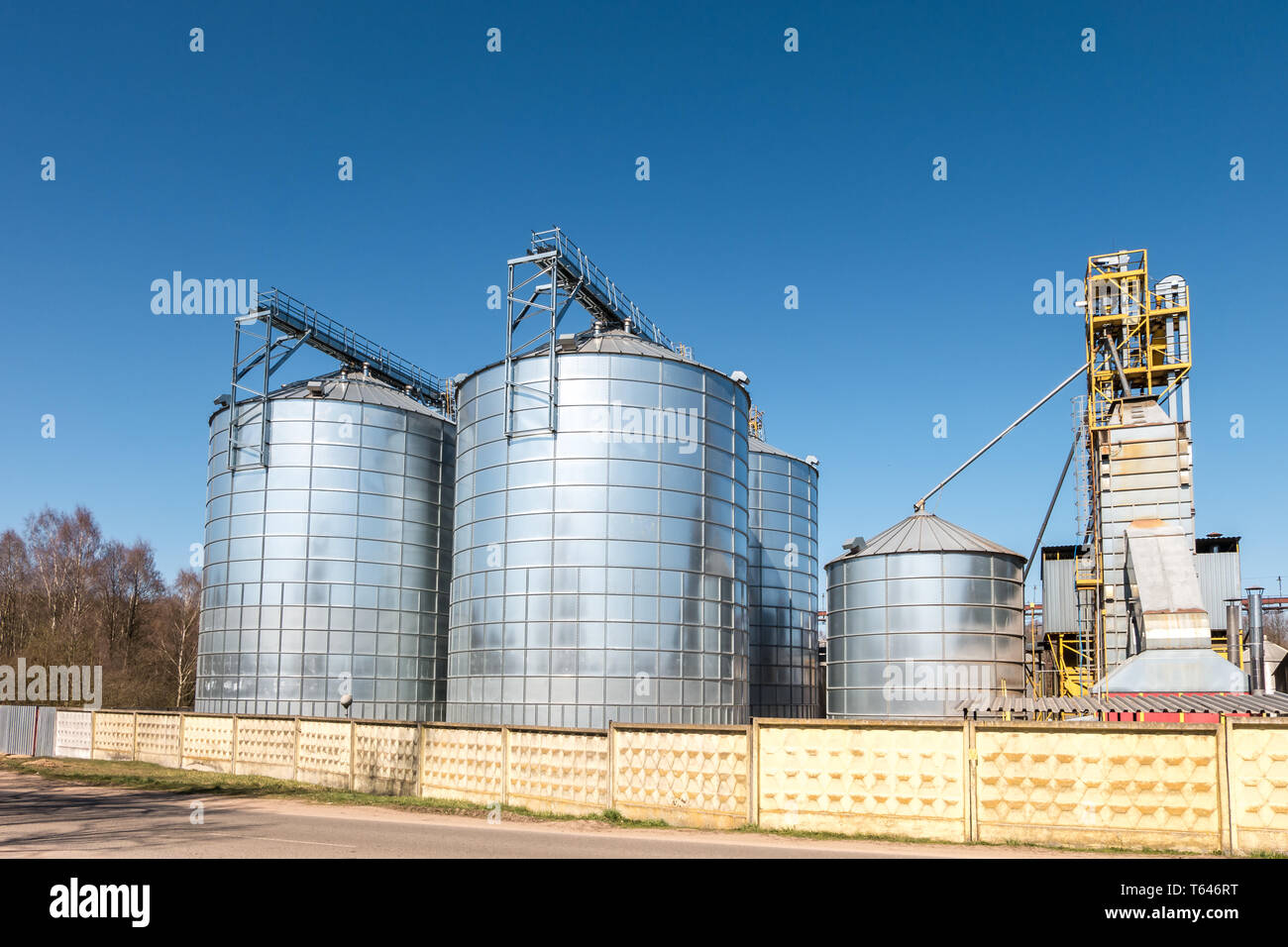 agro-processing plant for processing and silver silos for drying ...