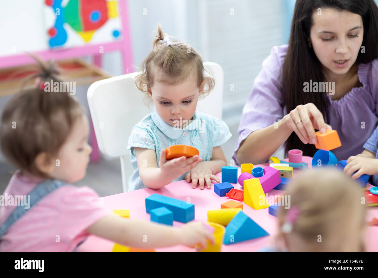 Babies in kindergarten. Kids toddlers in nursery school. Little