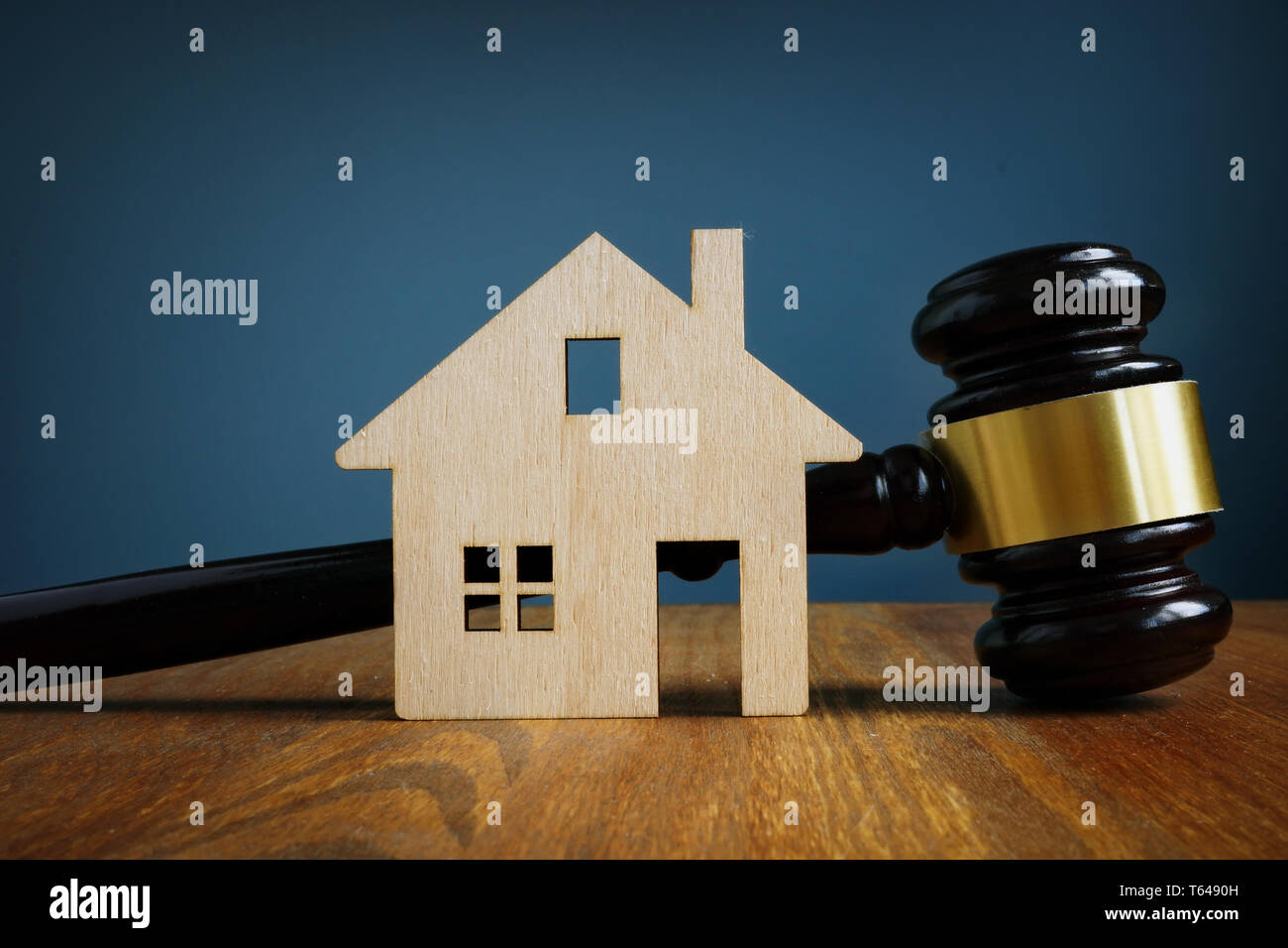 Model of house and gavel. Real estate law concept. Stock Photo