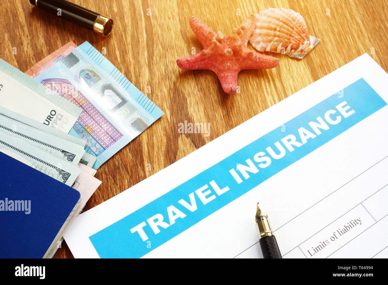 Travel insurance form with passport and cash Stock Photo Alamy