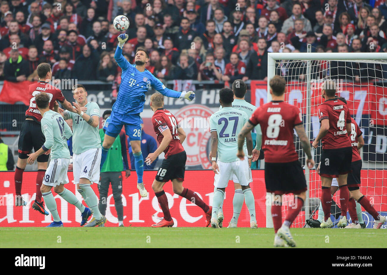 Nuremberg, Germany. 28th Apr, 2019. Bayern Munich's goalkeeper Sven Ulreich (4th R) punches the ball during a German Bundesliga match between 1.FC Nuremberg and FC Bayern Munich in Nuremberg, Germany, on April 28, 2019. The match ended 1-1. Credit: Philippe Ruiz/Xinhua/Alamy Live News Stock Photo