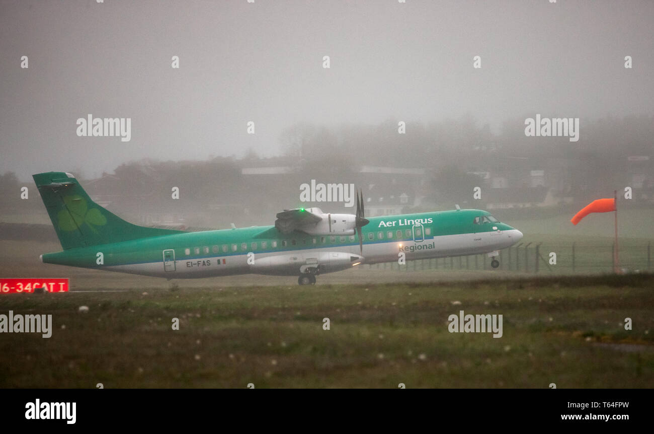 Cork Airport, Cork, Ireland. 29th Apr, 2019. An Aer Lingus Regional ATR 72 aircraft operated by Stobart Air takes off for Edinburgh from runway 16-34 on a very foggy morning at Cork Airport, Cork, Ireland. Credit: David Creedon/Alamy Live News Stock Photo