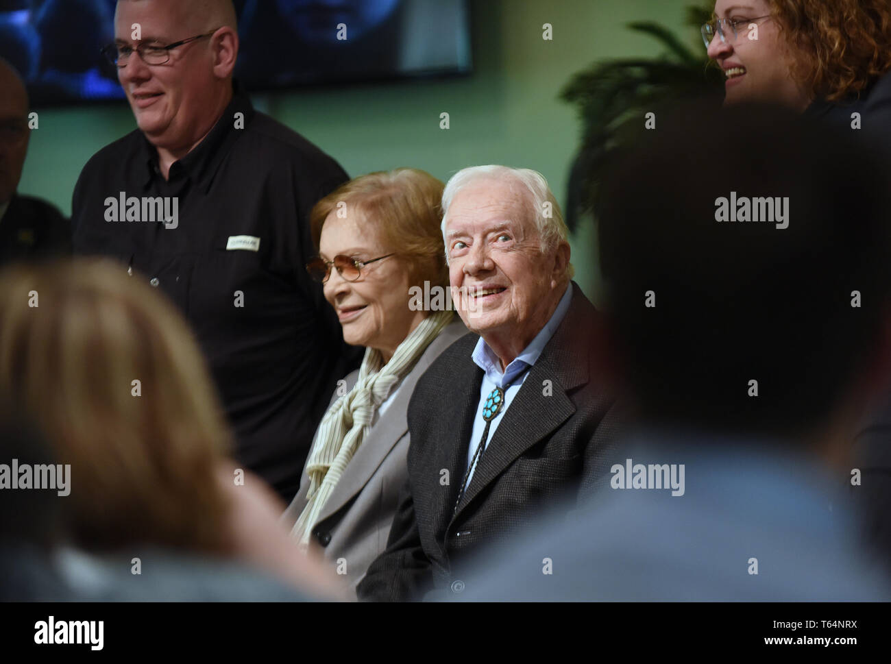 Plains, Georgia, USA. 28th Apr 2019. Former U.S. President Jimmy Carter and his wife, Rosalynn Carter, pose for a photograph with church attendees at Maranatha Baptist Church after Carter taught Sunday school in his hometown of Plains, Georgia on April 28, 2019. Carter, 94, has taught Sunday school at the church on a regular basis since leaving the White House in 1981, drawing hundreds of visitors who arrive hours before the 10:00 am lesson in order to get a seat and have a photograph taken with the former President and former First Lady Rosalynn Carter. Credit: Paul Hennessy/Alamy Live News Stock Photo