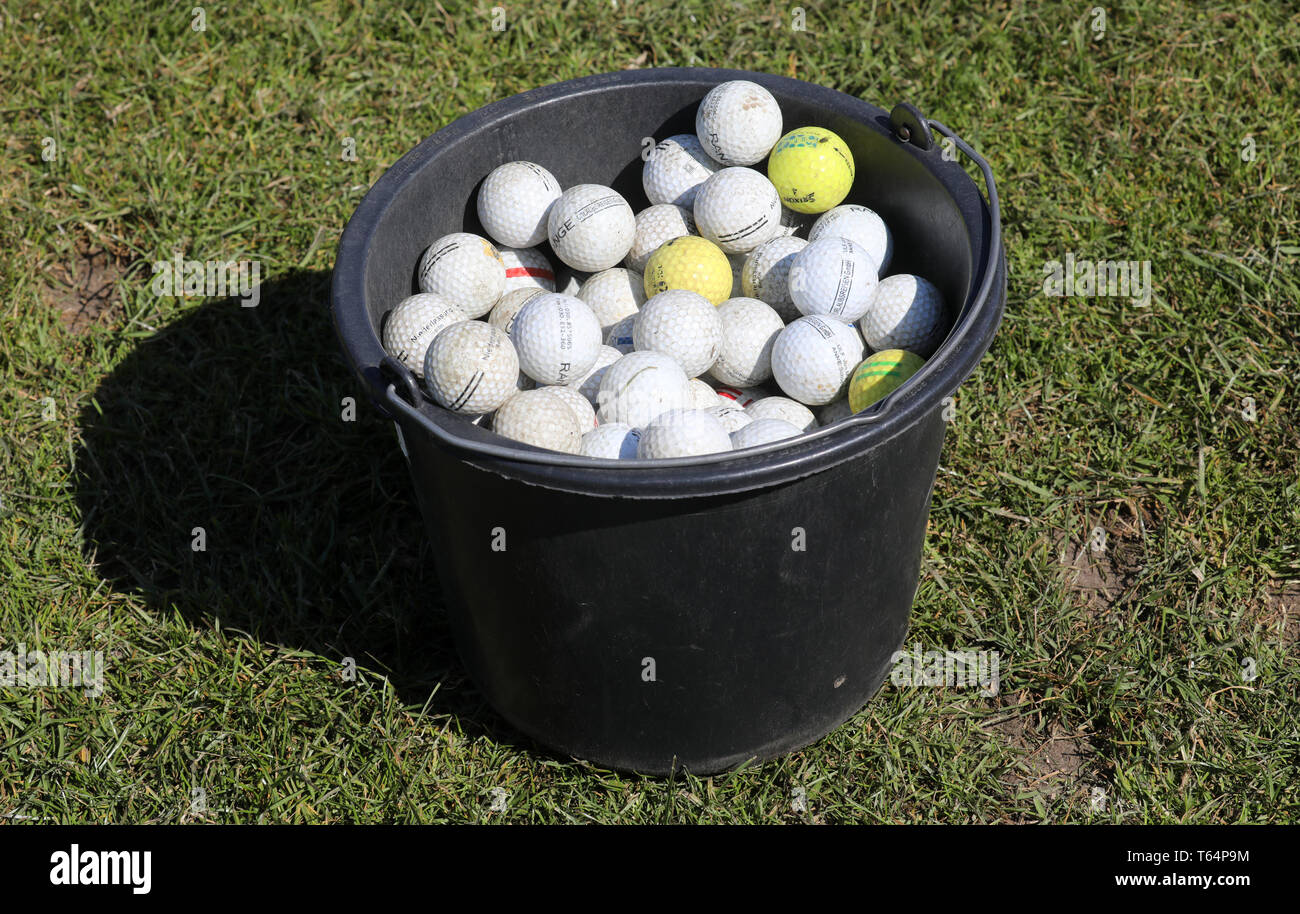 Golf balls and bucket hi-res stock 