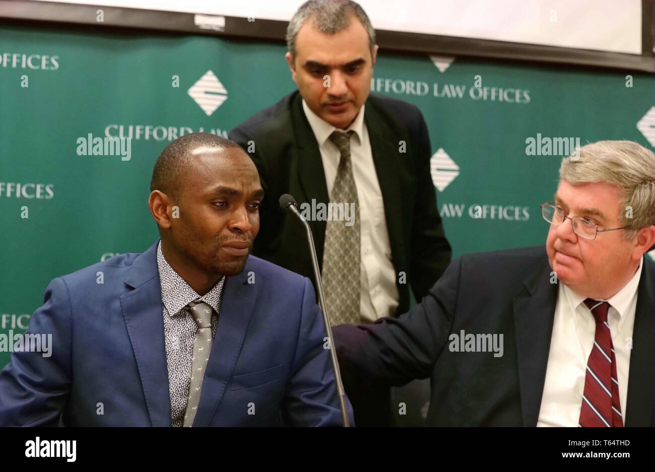 Chicago, USA. 29th Apr, 2019. Plaintiff Paul Njoroge (L), who lost five family members in the crash of the Ethiopian Airlines Flight 302, reacts during a news conference in downtown Chicago, the United States, on April 29, 2019. Two families filed lawsuits against Boeing in Chicago on Monday over the 737 MAX crashes that killed 346 people, the same day when Boeing held its shareholders meeting at the James Simpson Theatre in the Field Museum of Natural History in downtown Chicago. Credit: Wang Ping/Xinhua/Alamy Live News Stock Photo