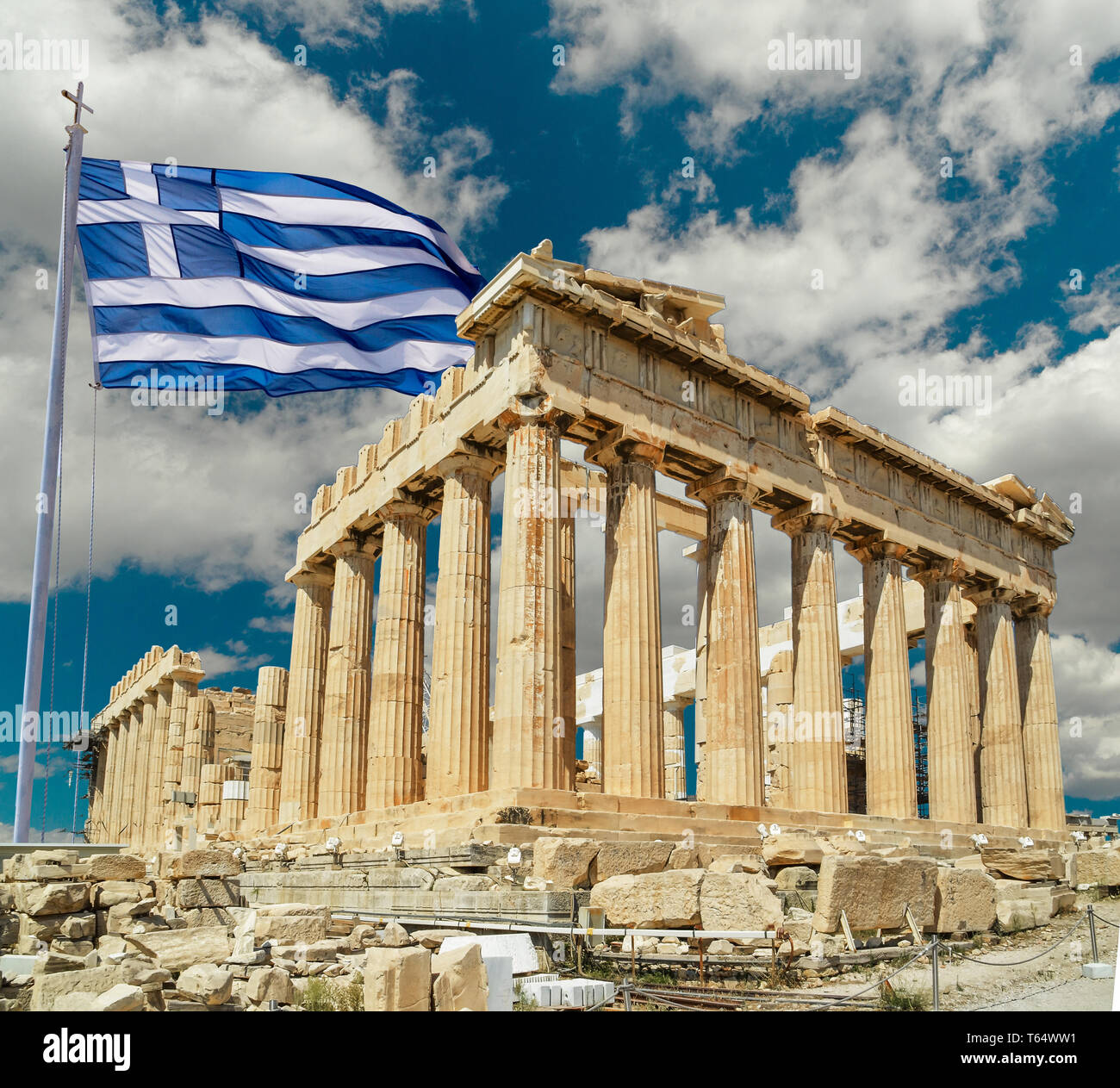 parthenon athens greeece and greek flag waving on cloudy sky Stock Photo