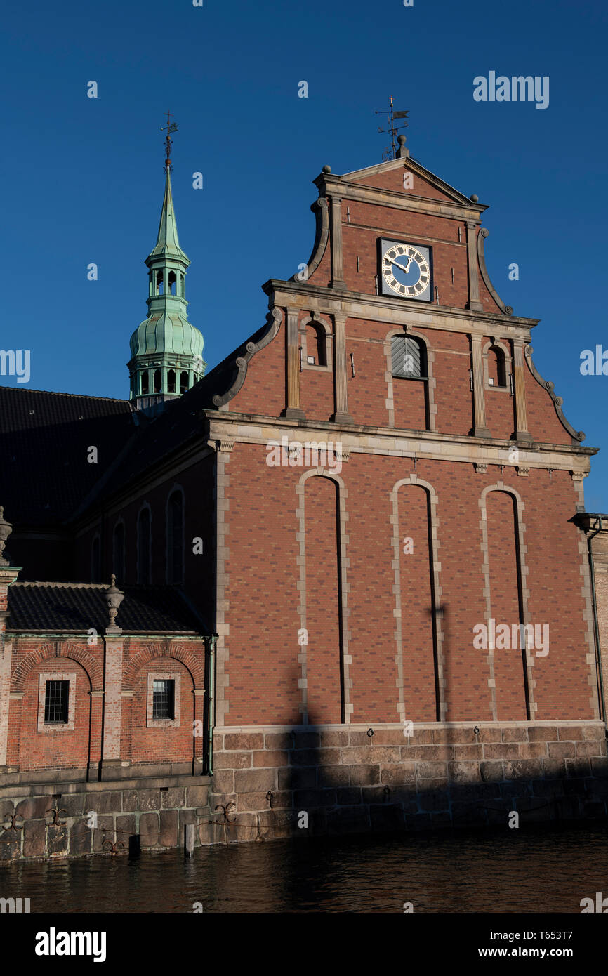 Holmen Church with clock and spire in background, outside Christiansborg Palace, Copenhagen, Denmark Stock Photo
