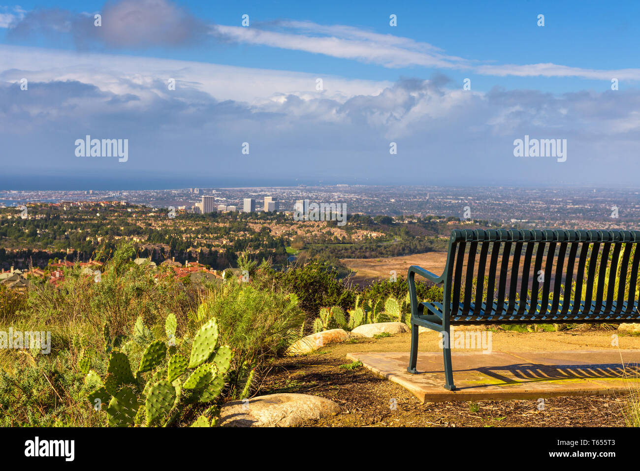 Bench overlooking Huntington Beach from the Vista Ridge Park in California Stock Photo