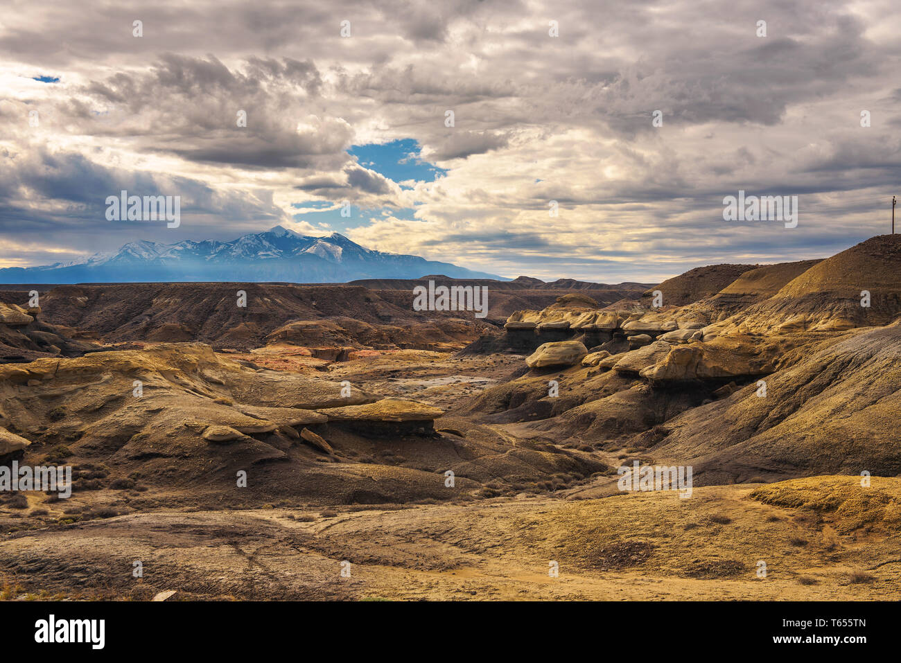 Badlands in Utah with snowy mountains Stock Photo