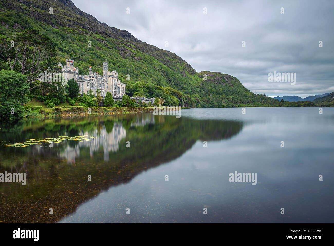 Kylemore Abbey in Ireland with reflections in the Pollacapall Lough Stock Photo