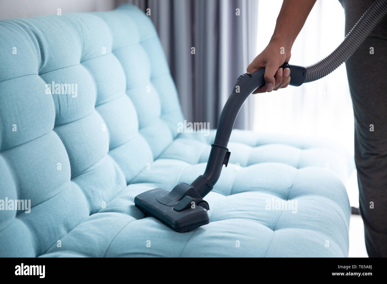 hand using vacuum cleaner Stock Photo - Alamy