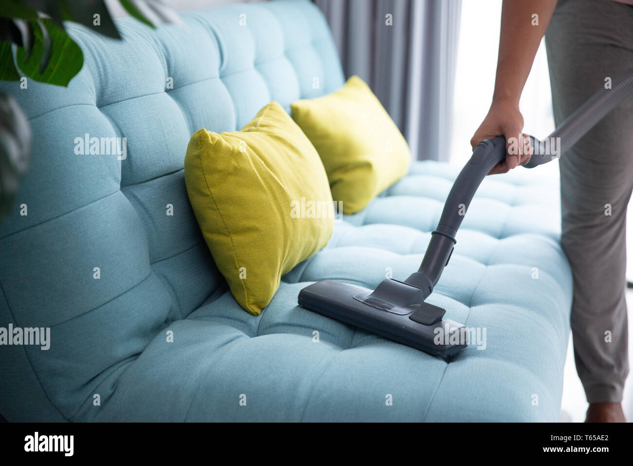 man using vacuum cleaner Stock Photo - Alamy