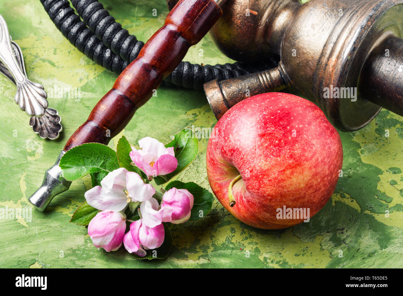 Oriental smoking hookah. Arabian shisha with apple. Hookah and apple