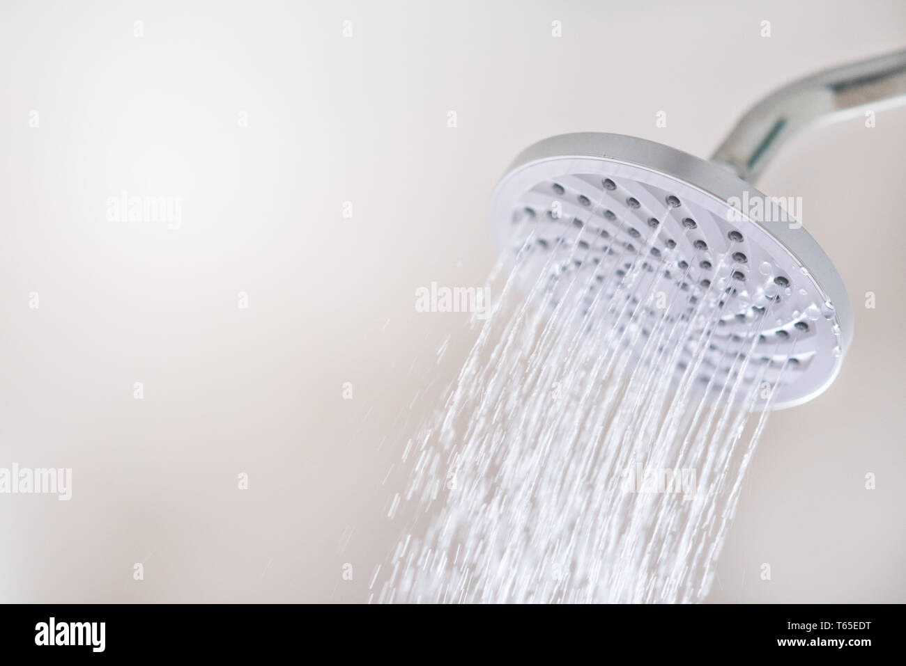 Close up of a Shower head with running water motion. concept of hygiene