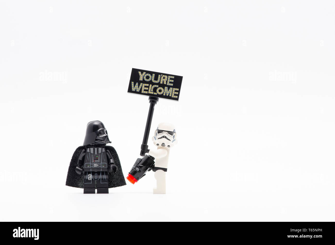 lego darth vader with storm trooper holding you are welcome sign. Lego  minifigures are manufactured by The Lego Group Stock Photo - Alamy
