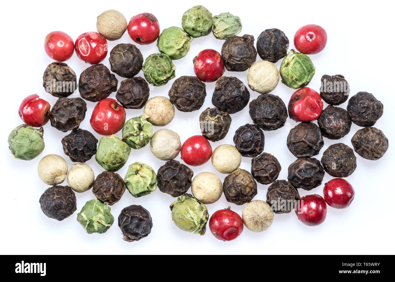 Black, white, green and red peppercorns isolated on white background