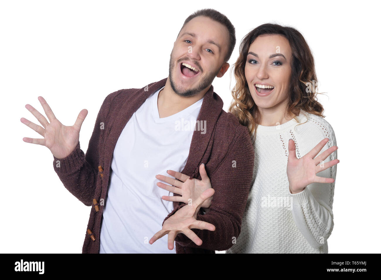 Portrait of happy young couple on white background Stock Photo - Alamy