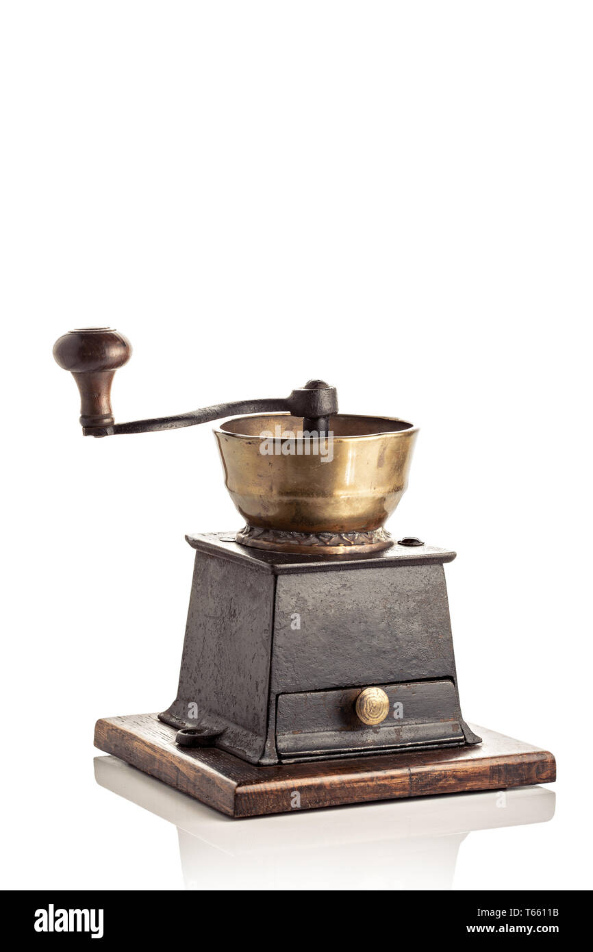 Antique Brass and cast iron coffee grinder isolated on white background