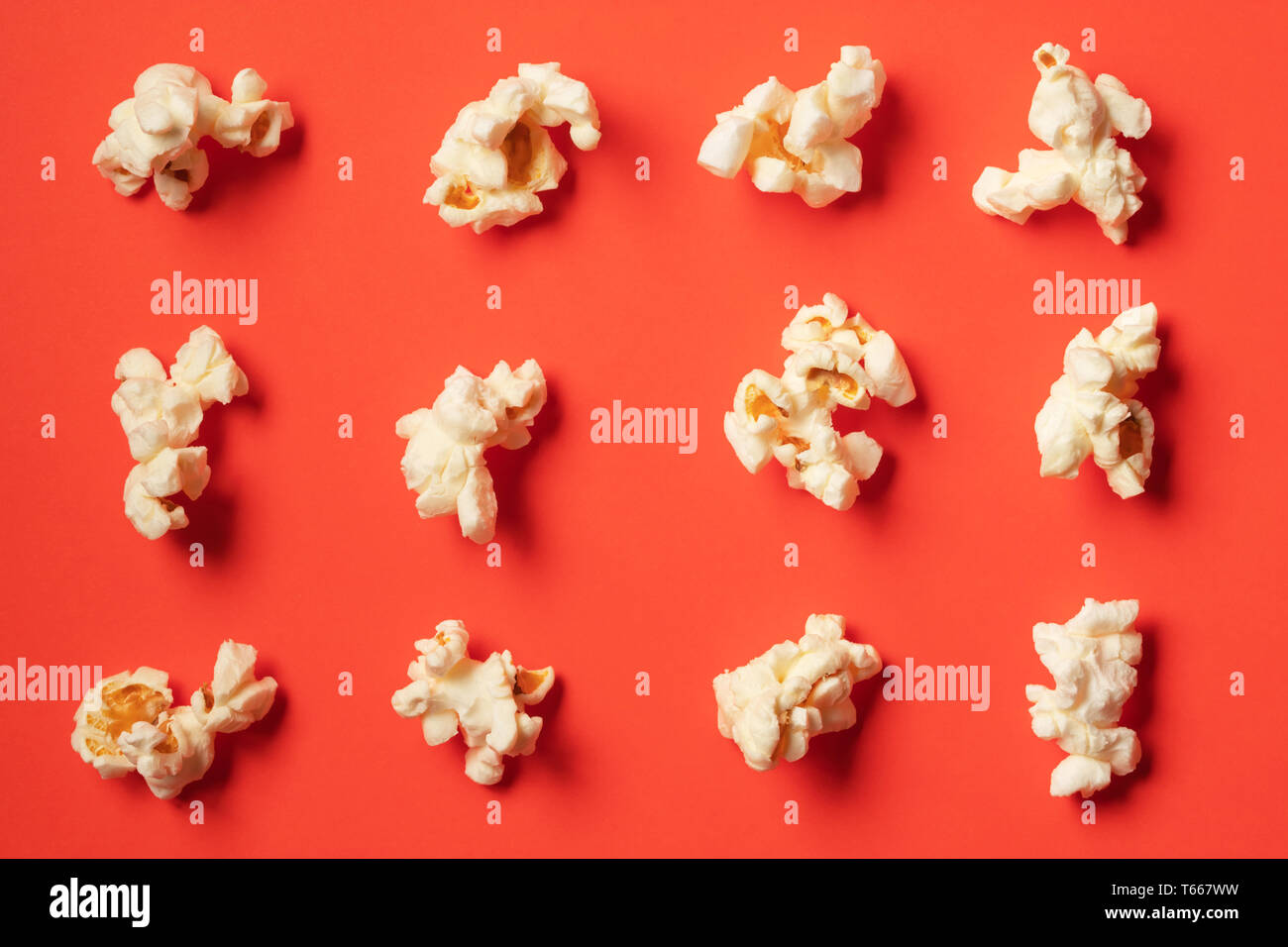 Popcorn pattern on red background. Flat lay Stock Photo