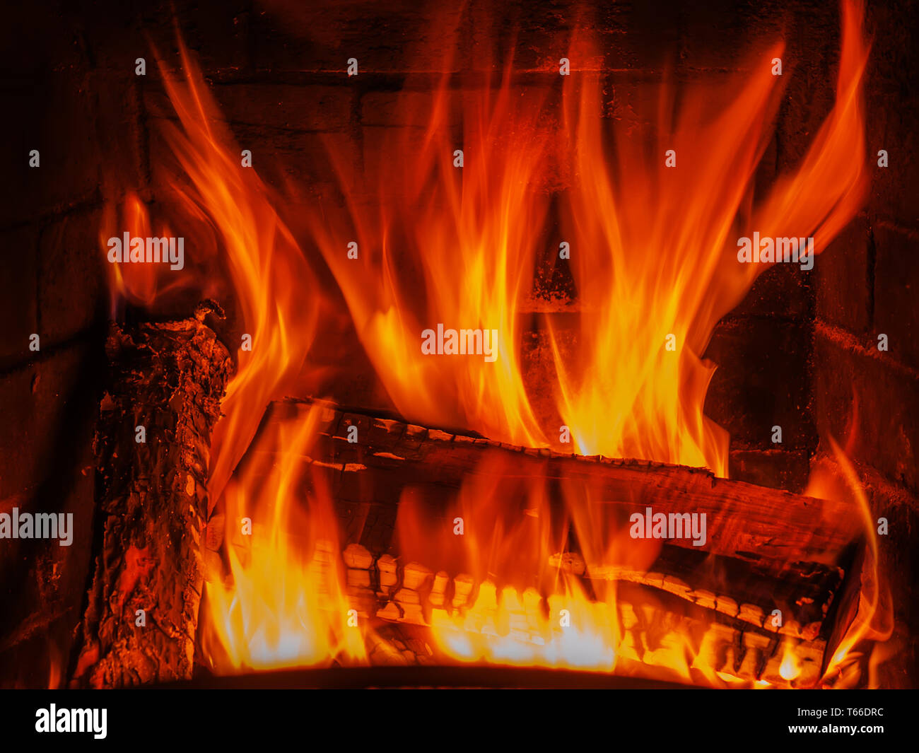 fireplace with wood and fire Stock Photo - Alamy