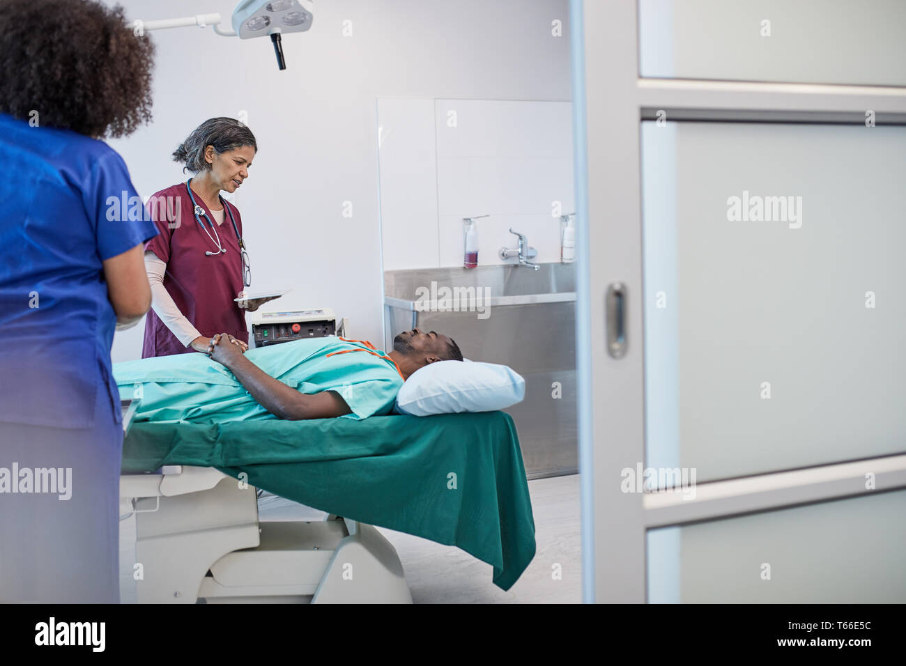 Surgeon talking with patient, preparing for surgery in clinic Stock Photo