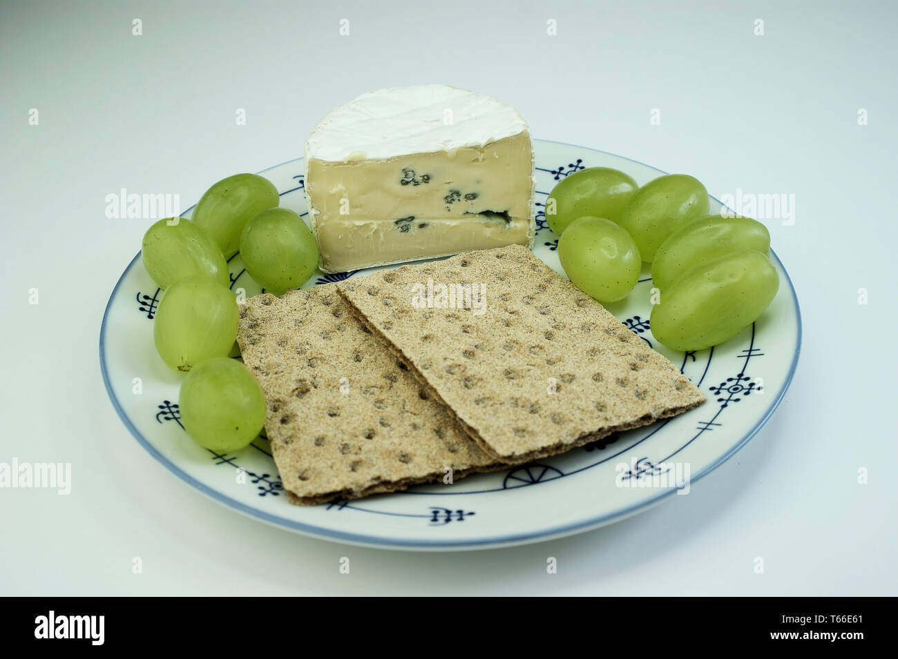 Hard bread with blue cheese and grapes Stock Photo