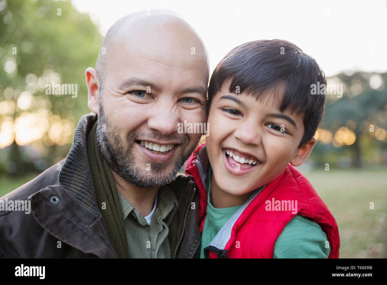 Portrait happy father and son in park Stock Photo