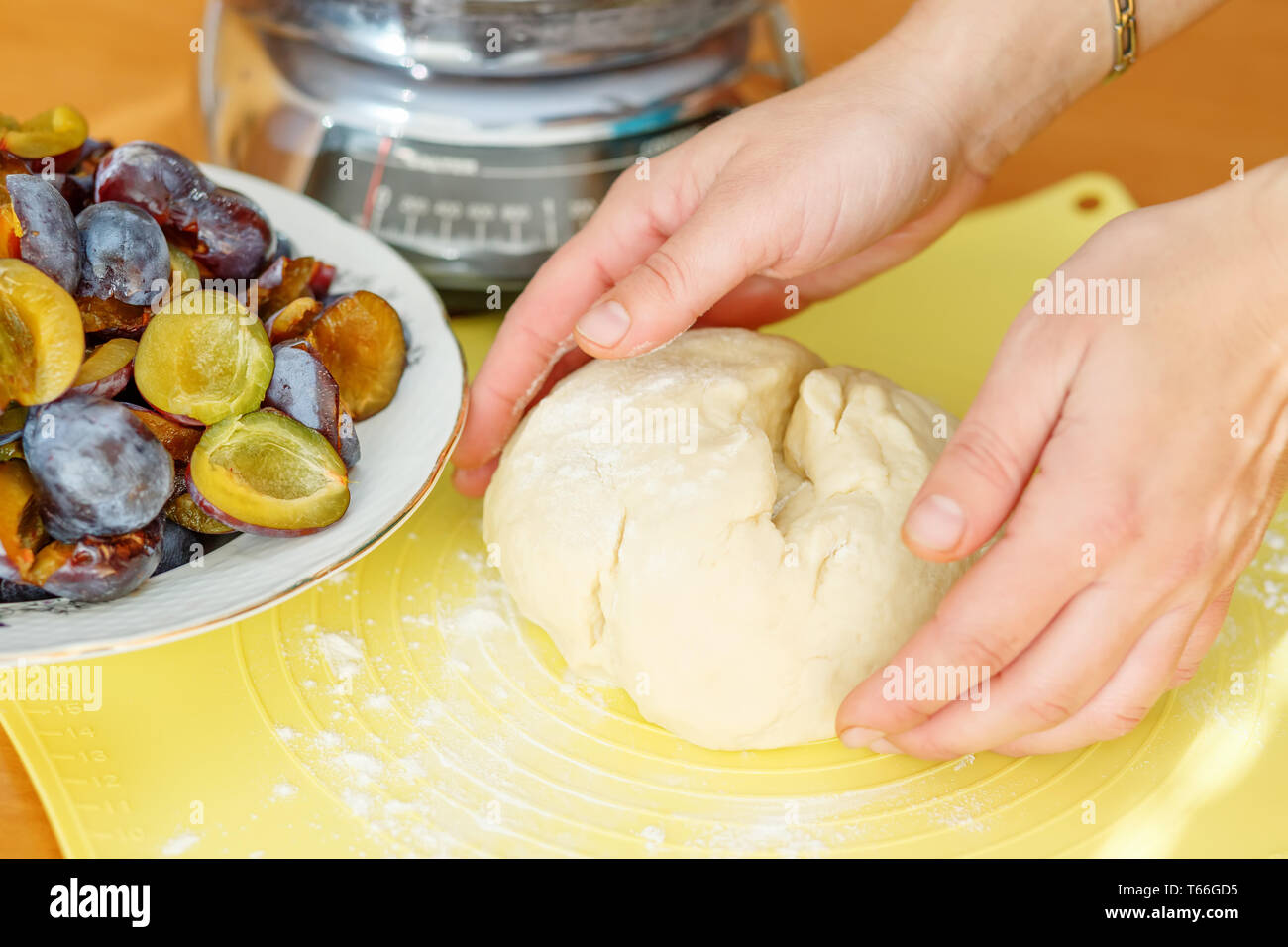 preparing dough for plum cake Stock Photo