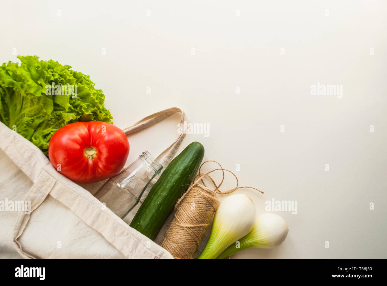 Fresh fruits and vegetables in eco bag with copyspace. Plastic free concept. Stock Photo