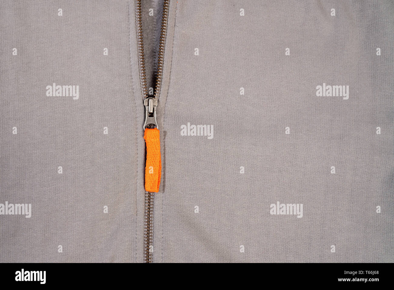 Orange zipper on sweatshirt design and fashion concept . Stock Photo