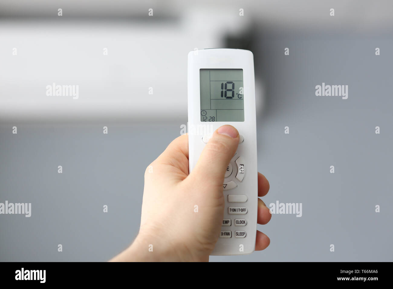 Male hand hold remote air conditioning Stock Photo Alamy